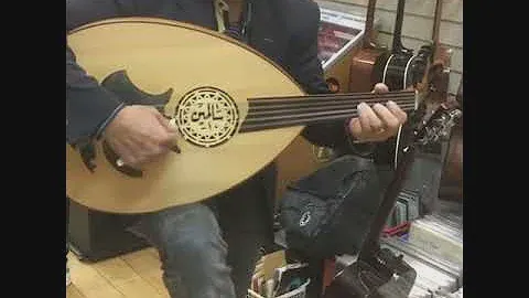 Hassan Chalf playing lute, trying a new AKG mic